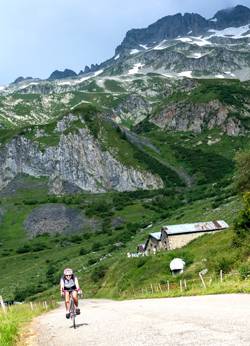 cyclist on road above Bourg St Maurice